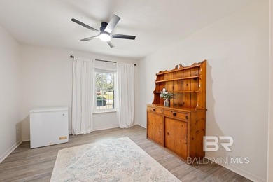 This charming, updated home with a wraparound front porch is on Lake Forest Yacht and Country Club in Alabama - for sale on GolfHomes.com, golf home, golf lot