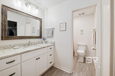 This charming, updated home with a wraparound front porch is on Lake Forest Yacht and Country Club in Alabama - for sale on GolfHomes.com, golf home, golf lot