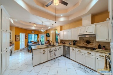 Tucked along the fairway in Rancho Escondido, this 4,037 sq ft on Rancho Viejo Resort and Country Club in Texas - for sale on GolfHomes.com, golf home, golf lot