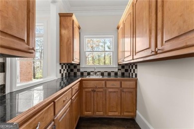 This stunning home is located in the prestigious gated section on The Golf Club of Georgia in Georgia - for sale on GolfHomes.com, golf home, golf lot
