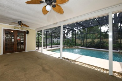 Beautiful Home with huge Sparkling Screened Pool with Private on Rio Pinar Golf and Country Club in Florida - for sale on GolfHomes.com, golf home, golf lot