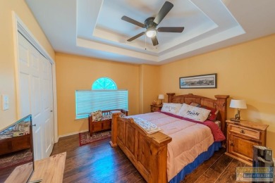 Tucked along the fairway in Rancho Escondido, this 4,037 sq ft on Rancho Viejo Resort and Country Club in Texas - for sale on GolfHomes.com, golf home, golf lot