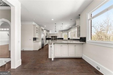 This stunning home is located in the prestigious gated section on The Golf Club of Georgia in Georgia - for sale on GolfHomes.com, golf home, golf lot