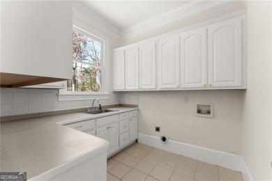 This stunning home is located in the prestigious gated section on The Golf Club of Georgia in Georgia - for sale on GolfHomes.com, golf home, golf lot
