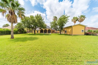 Tucked along the fairway in Rancho Escondido, this 4,037 sq ft on Rancho Viejo Resort and Country Club in Texas - for sale on GolfHomes.com, golf home, golf lot
