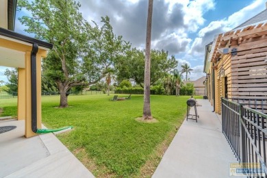 Tucked along the fairway in Rancho Escondido, this 4,037 sq ft on Rancho Viejo Resort and Country Club in Texas - for sale on GolfHomes.com, golf home, golf lot
