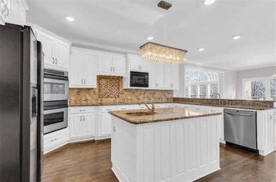 Behind the gates of Sugarloaf Country Club, this 7,000 plus sq on TPC At Sugarloaf Golf Club in Georgia - for sale on GolfHomes.com, golf home, golf lot