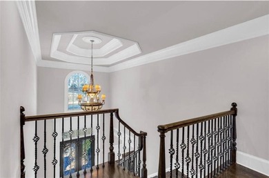 Behind the gates of Sugarloaf Country Club, this 7,000 plus sq on TPC At Sugarloaf Golf Club in Georgia - for sale on GolfHomes.com, golf home, golf lot