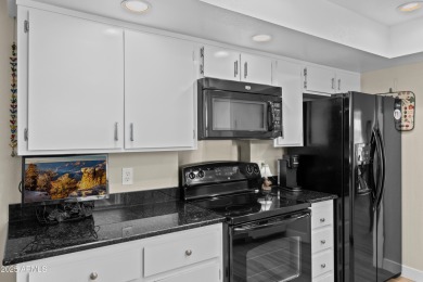 This beautifully maintained 2-bedroom, 2-bath home backs to on Ahwatukee Country Club in Arizona - for sale on GolfHomes.com, golf home, golf lot