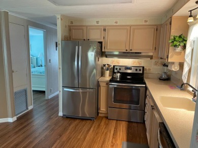 This lovely, manufactured home is in Lake Fairways Country Club on Pine Lakes Country Club in Florida - for sale on GolfHomes.com, golf home, golf lot