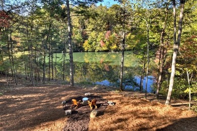 Overlooking a serene hidden lake-known by some residents as on White Path Golf Club in Georgia - for sale on GolfHomes.com, golf home, golf lot