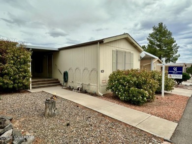 Nestled among the pines, this charming 2-bedroom, 2-bath home on Pine Shadows Golf Course in Arizona - for sale on GolfHomes.com, golf home, golf lot
