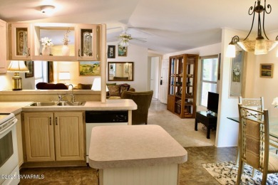 Nestled among the pines, this charming 2-bedroom, 2-bath home on Pine Shadows Golf Course in Arizona - for sale on GolfHomes.com, golf home, golf lot