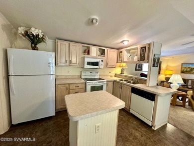 Nestled among the pines, this charming 2-bedroom, 2-bath home on Pine Shadows Golf Course in Arizona - for sale on GolfHomes.com, golf home, golf lot