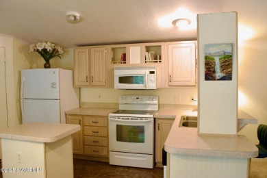 Nestled among the pines, this charming 2-bedroom, 2-bath home on Pine Shadows Golf Course in Arizona - for sale on GolfHomes.com, golf home, golf lot