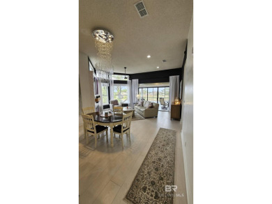 EXQUISITE TOP FLOOR LUXURY GATED CONDO IN THE HEART OF GULF on Craft Farms - Cypress Bend in Alabama - for sale on GolfHomes.com, golf home, golf lot
