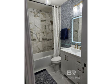 EXQUISITE TOP FLOOR LUXURY GATED CONDO IN THE HEART OF GULF on Craft Farms - Cypress Bend in Alabama - for sale on GolfHomes.com, golf home, golf lot
