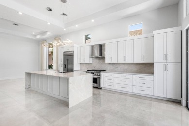 Beautifully renovated single story home available in Ballenisles on BallenIsles Golf and Country Club in Florida - for sale on GolfHomes.com, golf home, golf lot