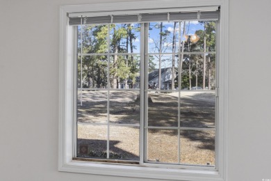 Discover this charming first-floor, end-unit condo located in on  in South Carolina - for sale on GolfHomes.com, golf home, golf lot