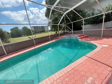 Discover this elegant 2-story residence in the highly on Palm-Aire Country Club and Resort - The Oaks in Florida - for sale on GolfHomes.com, golf home, golf lot