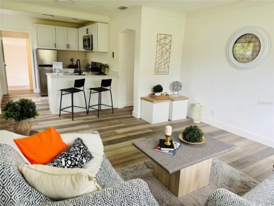 Nestled in the tranquil Edgemoor Estates neighborhood, this cozy on Mangrove Bay Golf Course in Florida - for sale on GolfHomes.com, golf home, golf lot
