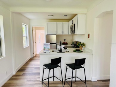 Nestled in the tranquil Edgemoor Estates neighborhood, this cozy on Mangrove Bay Golf Course in Florida - for sale on GolfHomes.com, golf home, golf lot