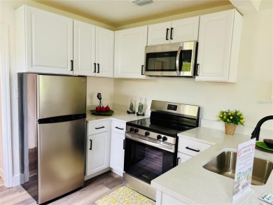 Nestled in the tranquil Edgemoor Estates neighborhood, this cozy on Mangrove Bay Golf Course in Florida - for sale on GolfHomes.com, golf home, golf lot