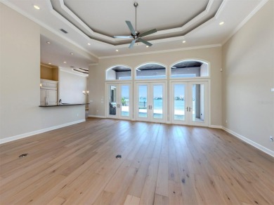 One or more photo(s) has been virtually staged. Waterfront on Bird Bay Executive Golf Club in Florida - for sale on GolfHomes.com, golf home, golf lot