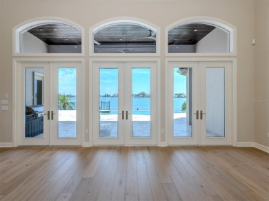 One or more photo(s) has been virtually staged. Waterfront on Bird Bay Executive Golf Club in Florida - for sale on GolfHomes.com, golf home, golf lot