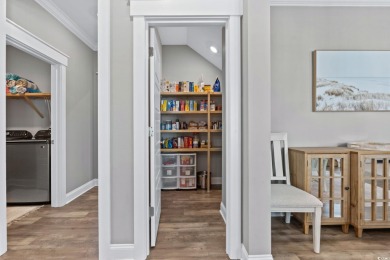 This property is an exquisite single-family residence nestled in on The Dunes Golf and Beach Club in South Carolina - for sale on GolfHomes.com, golf home, golf lot