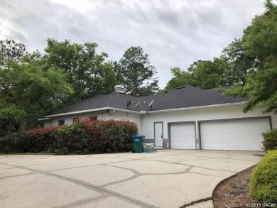 This 4-bedroom, 3.5 bathroom pool home backing to the green of on Turkey Creek Golf and Country Club in Florida - for sale on GolfHomes.com, golf home, golf lot