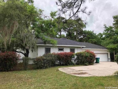 This 4-bedroom, 3.5 bathroom pool home backing to the green of on Turkey Creek Golf and Country Club in Florida - for sale on GolfHomes.com, golf home, golf lot