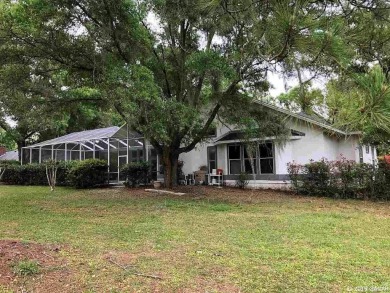 This 4-bedroom, 3.5 bathroom pool home backing to the green of on Turkey Creek Golf and Country Club in Florida - for sale on GolfHomes.com, golf home, golf lot