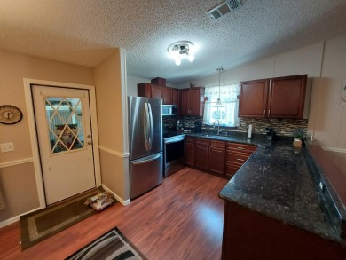 This beautiful home is loaded with upgrades. Both bathrooms have on Lakes at Leesburg Golf Course in Florida - for sale on GolfHomes.com, golf home, golf lot