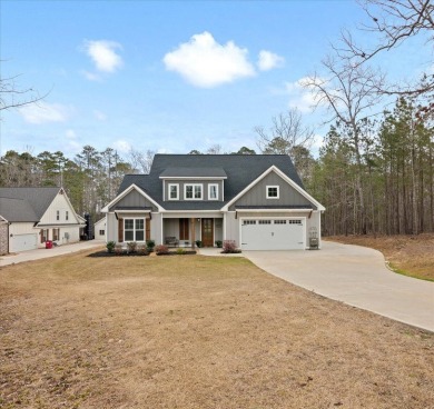 Beautiful 4-bedroom 3.5 bathrooms Waterfront home sitting on 1 on Rocky Branch Golf Club in Georgia - for sale on GolfHomes.com, golf home, golf lot