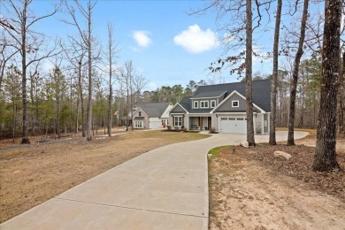 Beautiful 4-bedroom 3.5 bathrooms Waterfront home sitting on 1 on Rocky Branch Golf Club in Georgia - for sale on GolfHomes.com, golf home, golf lot