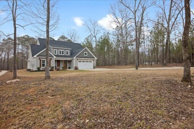 Beautiful 4-bedroom 3.5 bathrooms Waterfront home sitting on 1 on Rocky Branch Golf Club in Georgia - for sale on GolfHomes.com, golf home, golf lot
