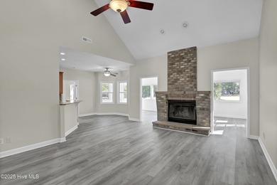 Welcome to this custom-built brick home with an open floor plan on Olde Point Golf and Country Club in North Carolina - for sale on GolfHomes.com, golf home, golf lot