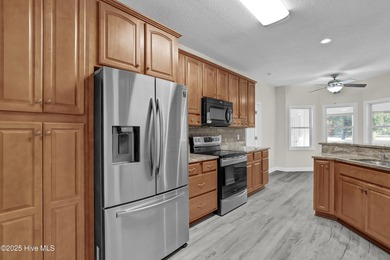 Welcome to this custom-built brick home with an open floor plan on Olde Point Golf and Country Club in North Carolina - for sale on GolfHomes.com, golf home, golf lot