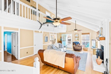 This charming beachfront cottage, located on Newport Street in on Sea Trail Golf Resort in North Carolina - for sale on GolfHomes.com, golf home, golf lot