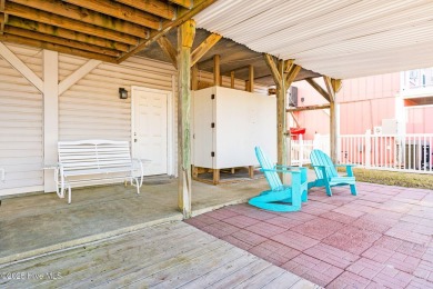 This charming beachfront cottage, located on Newport Street in on Sea Trail Golf Resort in North Carolina - for sale on GolfHomes.com, golf home, golf lot