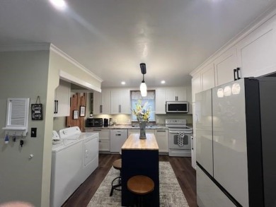 This is a totally remodeled, upgraded and updated 3 bedroom 2 on The Course At Turkey Mountain in Arkansas - for sale on GolfHomes.com, golf home, golf lot