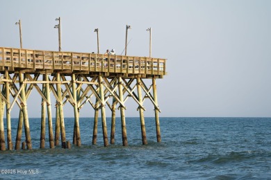 This charming beach cottage, located on Newport Street in Ocean on Sea Trail Golf Resort in North Carolina - for sale on GolfHomes.com, golf home, golf lot