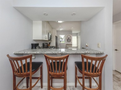 Light and bright ground floor two-bedroom, two-bath home enjoys on Plantation Golf and Country Club in Florida - for sale on GolfHomes.com, golf home, golf lot