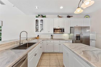 Welcome to 68 Egret Trail - A Golf Course Pool Home in the Heart on The Grand Club Cypress Course in Florida - for sale on GolfHomes.com, golf home, golf lot