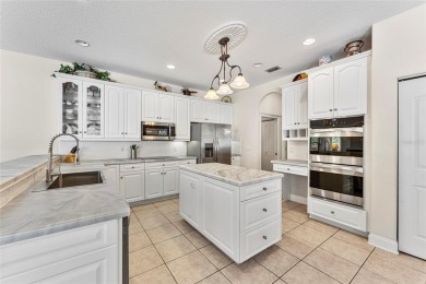 Welcome to 68 Egret Trail - A Golf Course Pool Home in the Heart on The Grand Club Cypress Course in Florida - for sale on GolfHomes.com, golf home, golf lot