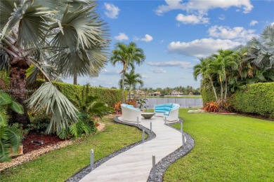 SPECTACULAR FAMILY HOME w/5 bedrooms and 5 1/2 bathrooms located on Weston Hills Country Club in Florida - for sale on GolfHomes.com, golf home, golf lot