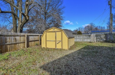 This lovely home with great curb appeal is awaiting its new on Horton Smith Golf Course in Missouri - for sale on GolfHomes.com, golf home, golf lot