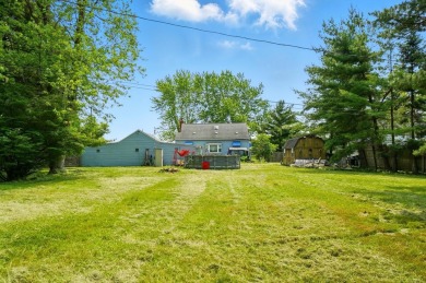 Nestled on a spacious .73-acre lot, this 3-bedroom, 1-bath Cape on Rocky Lakes Golf Course in Ohio - for sale on GolfHomes.com, golf home, golf lot