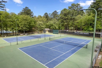 Experience the enchanting rhythm of nature year-round in this on Holly Lake Ranch Golf Club in Texas - for sale on GolfHomes.com, golf home, golf lot